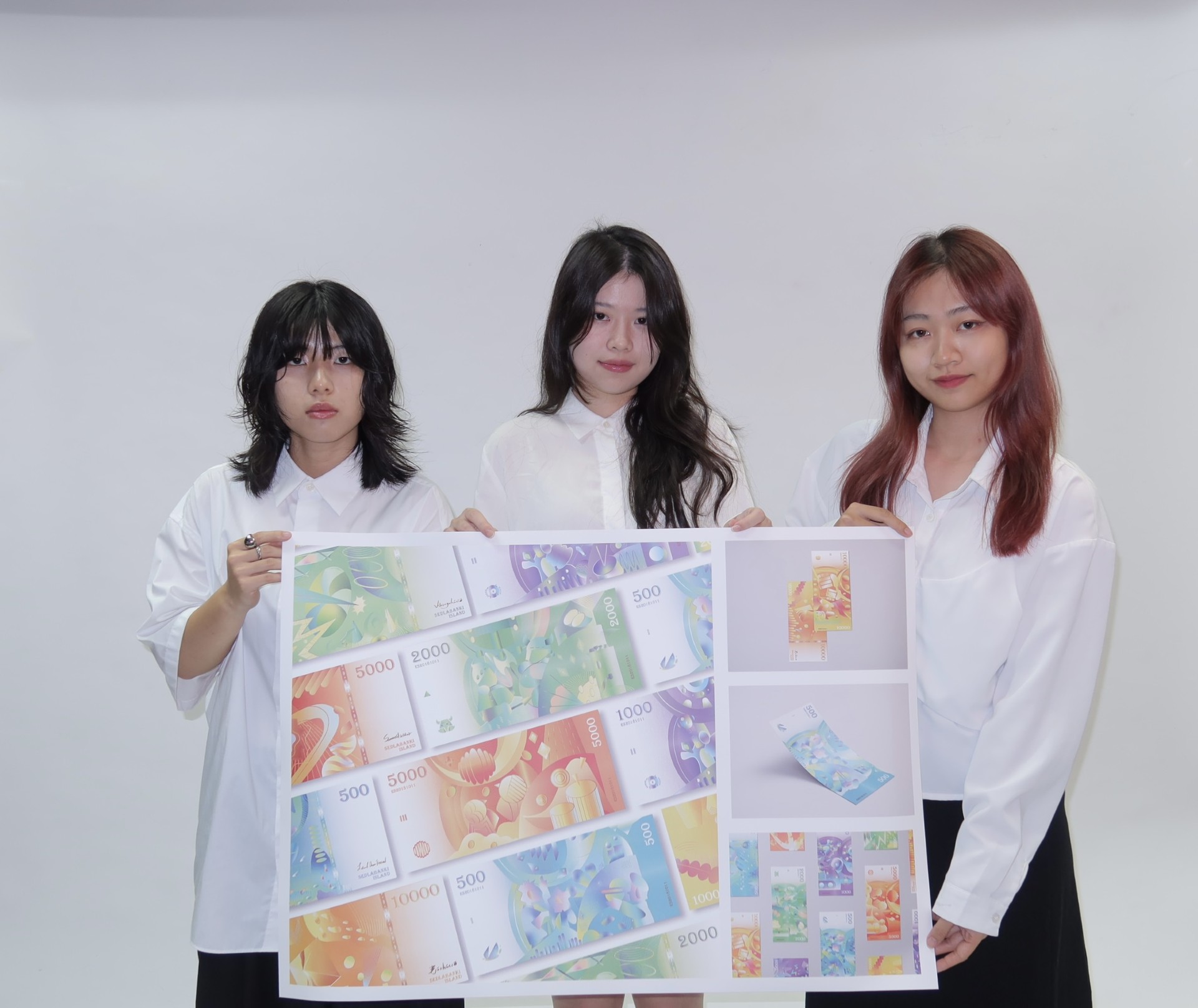 亞大數媒系郭佩雲、李佳甄、陳佳嫺同學，以「冰島節慶鈔票設計」作品獲「紅點獎」。